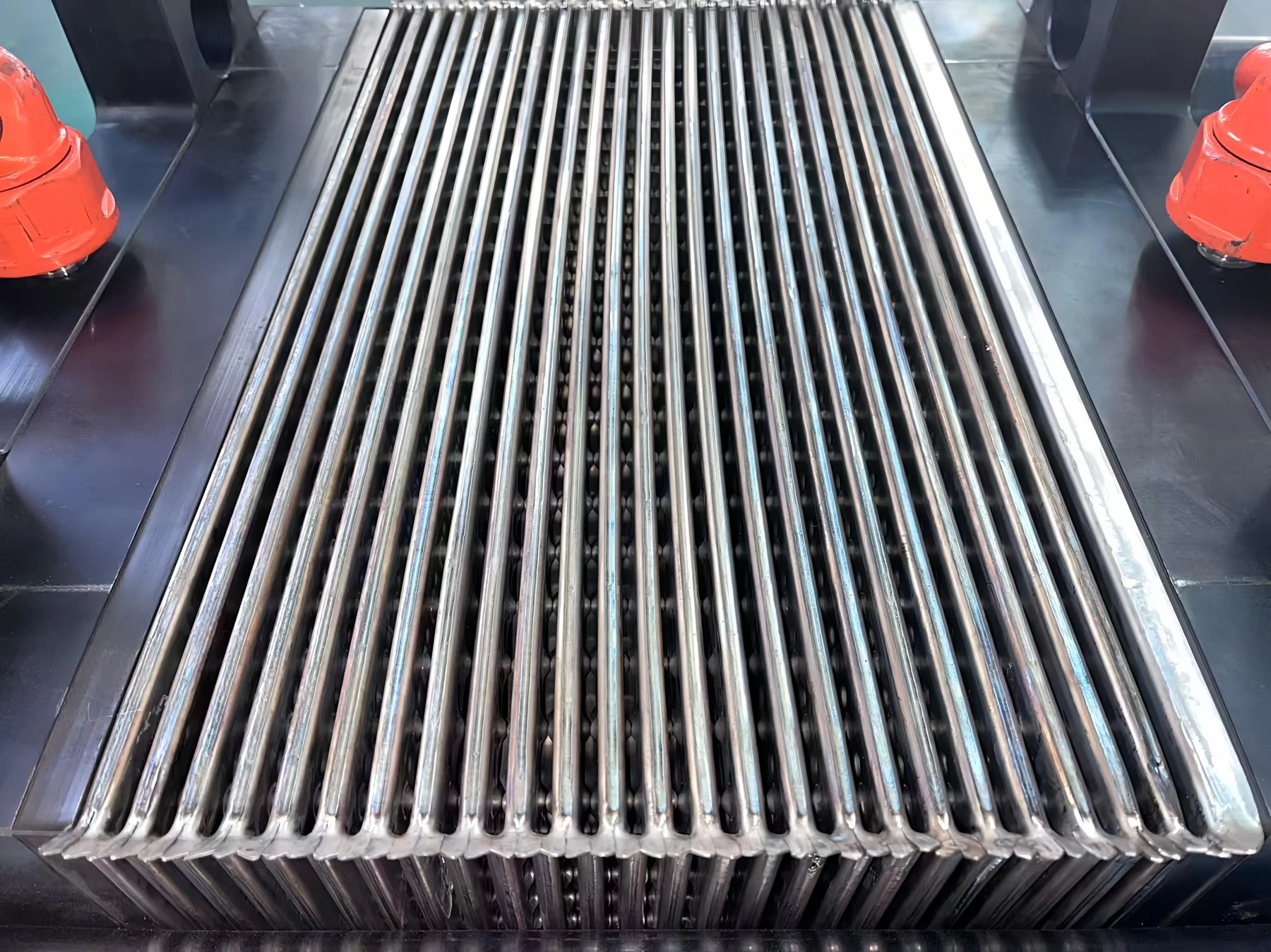 Formed plates in a welded plate pack